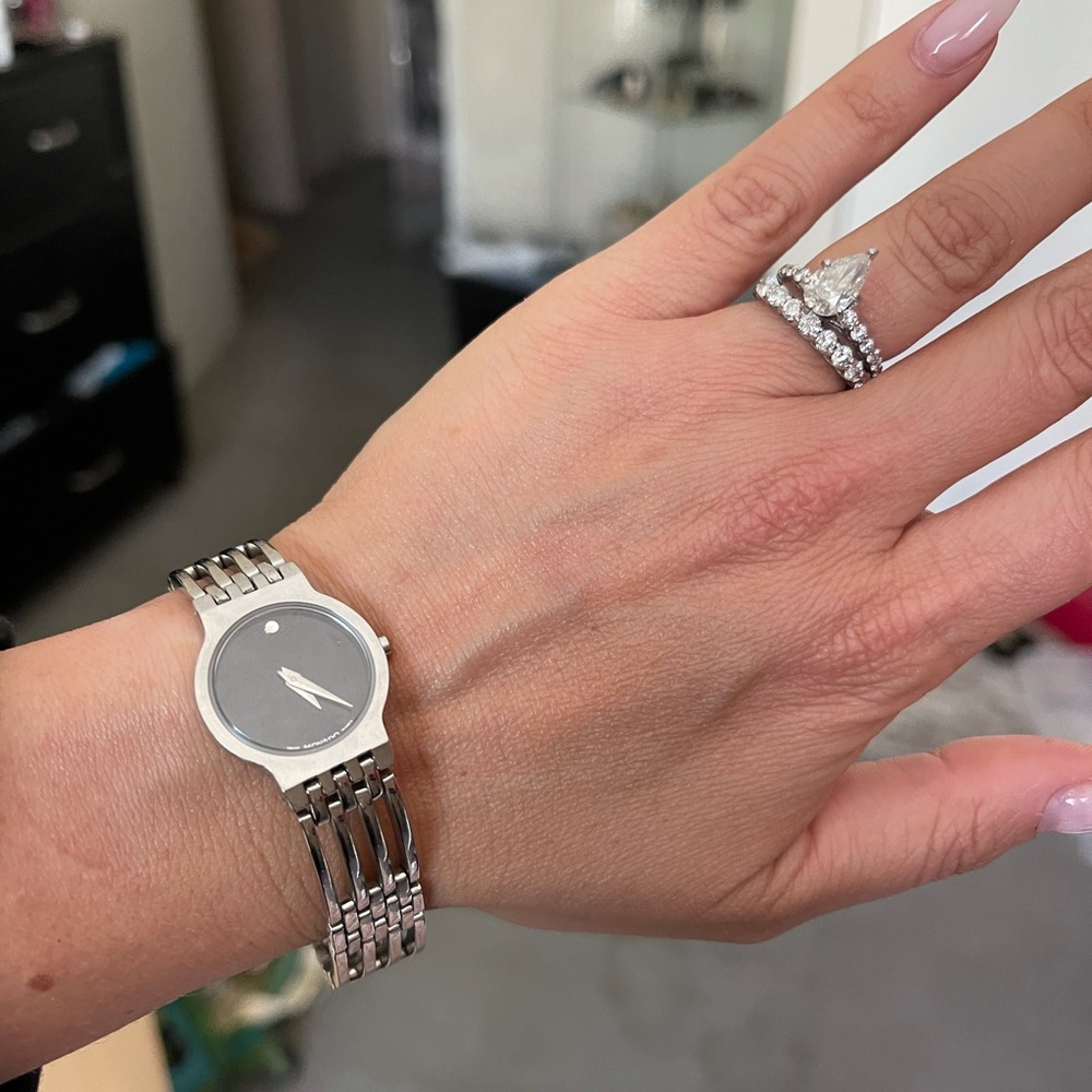 Movado silver watch with black face